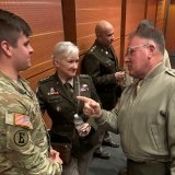 LtGen Broadmeadow and LTG Potter share a moment and speak with a Norwich student.