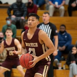 Norwich University men's basketball player gets ready to shoot a basket.