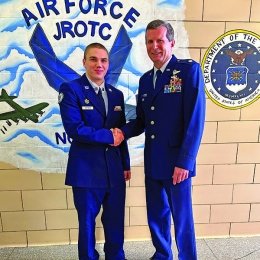 Alex Huffman ‘28 shaking hands with Lt Col Brian O’Connell