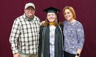 Ashley with family at graduation.