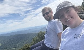 Ashleigh and husband on top of mountain