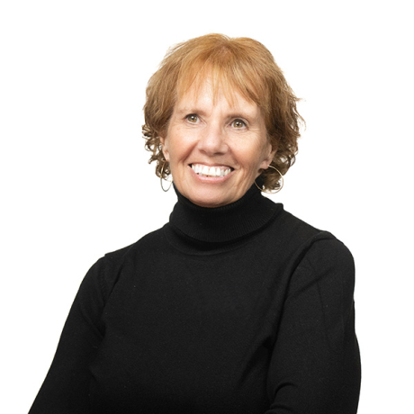 Professional headshot of a smiling Diane Scolaro