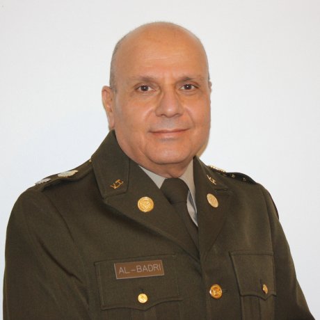 man with head shaved in uniform