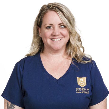Woman with shoulder-length blond hair in Norwich nursing scrubs