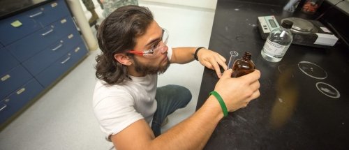 Norwich U Chemistry Student in Lab Setting