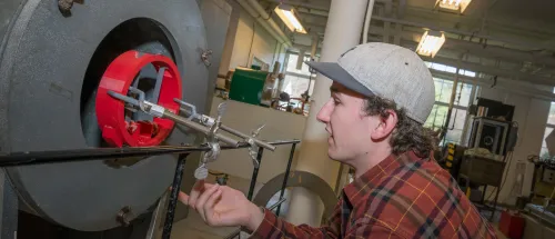 Norwich Mechanical Engineering student working on machine