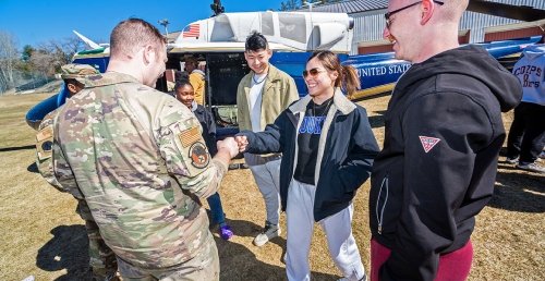 UH-1 Helicopter Landing on Norwich Campus interacting with Students