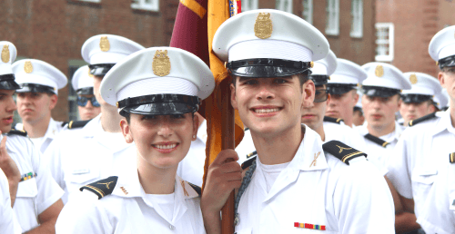 Corps of Cadets students smiling in formation.