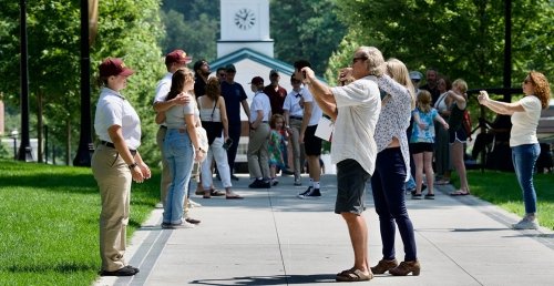 Norwich University Parents Photographing Rooks on sunny day