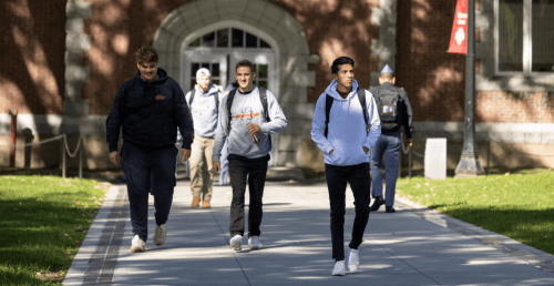 Norwich University students walking across campus