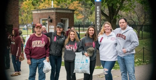 A Norwich family stands by the gates of Sabine Field.