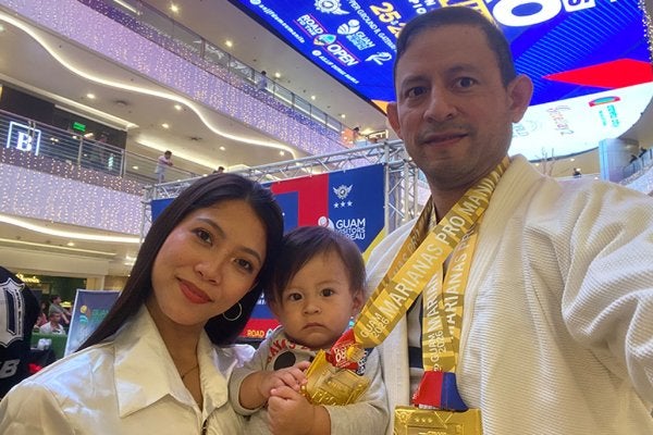 Daneil Fienco, wife, and baby, at Marianas Pro Mania