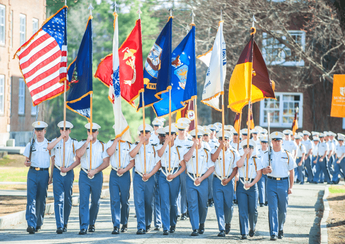 Corps of Cadets marching with all service branch flags.