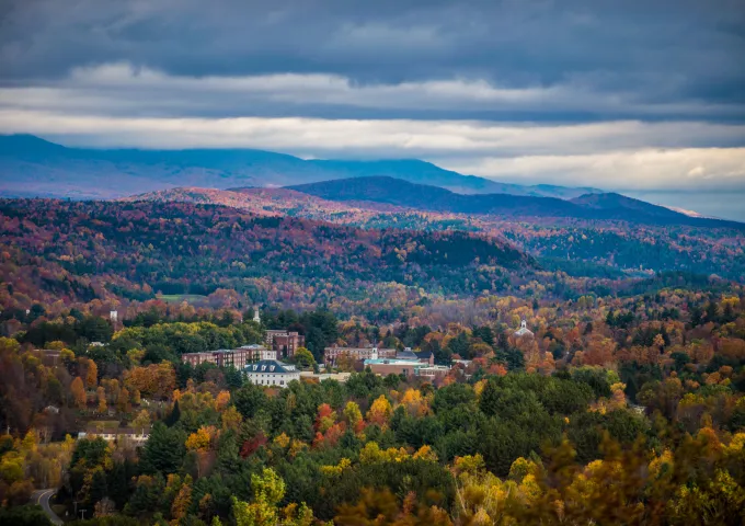 Aerial photo of Norwich University campus surrounded by mountains.