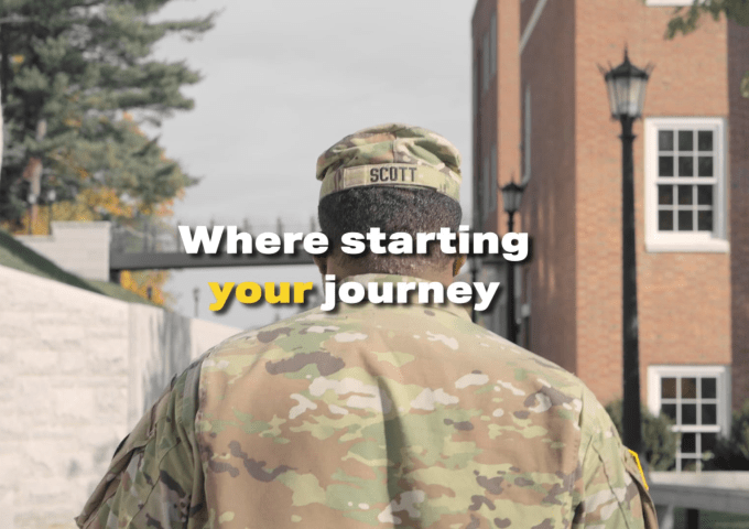 Male student in camo walking away from viewer. "Where starting your journey" overlaid as the beginning of the video.