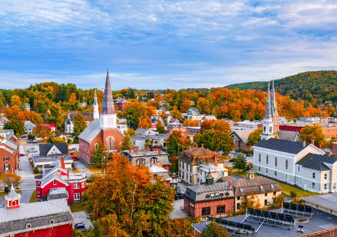 An aerial view of Montpelier surrounded by fall foliage.