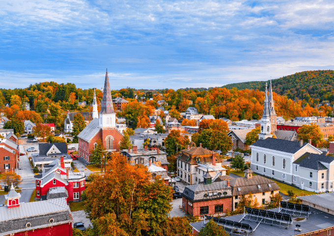 An aerial view of Montpelier surrounded by fall foliage.
