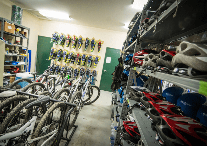 The storage room full of mountain bikes, snow shoes, cross country skis and more at Shaw Outdoor Center.