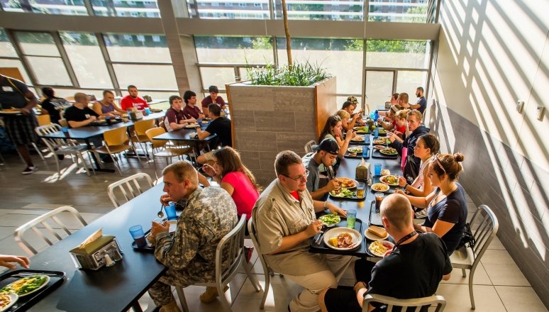 Norwich students eating together in the dining hall at the Wise Campus Center.