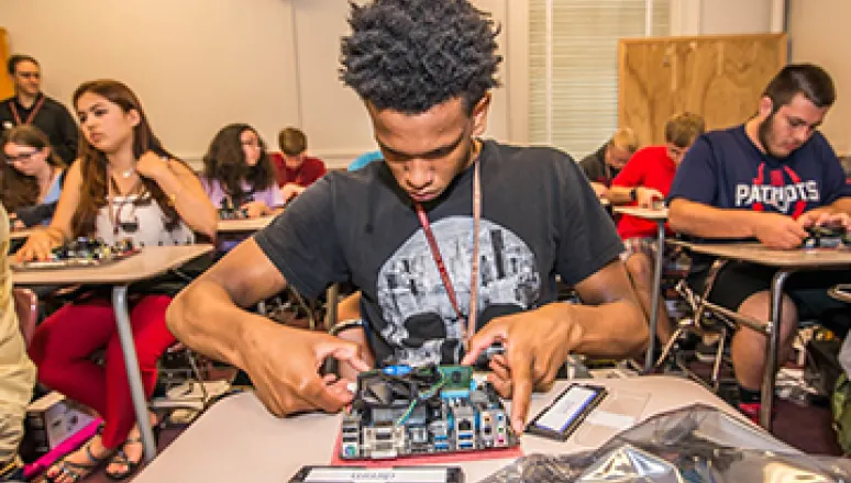 Gen Cyber Camp Student Building Computer