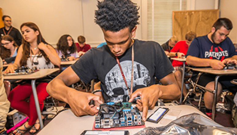 Gen Cyber Camp Student Building Computer