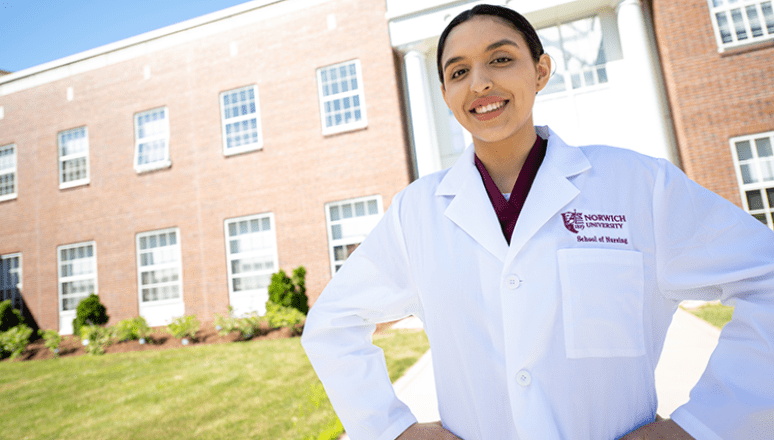 Nursing student in front of Bartoletto Hall.