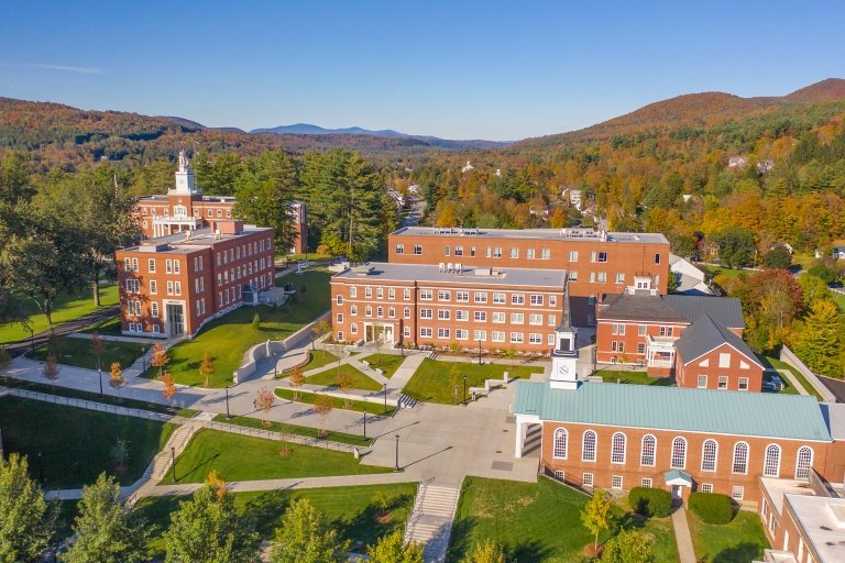 Aerial photo of Norwich University campus surrounded by mountains.