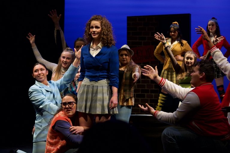 Tatum (far left), in a performance of The Heathers musical that was held by Pegasus Players.