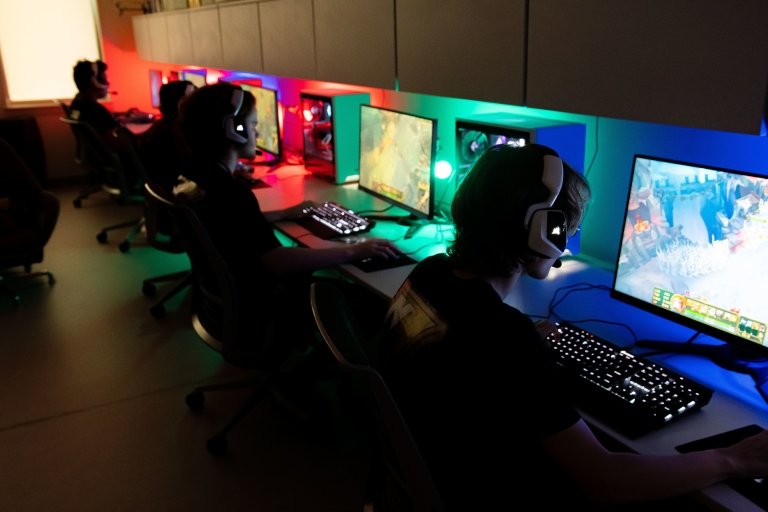 Norwich esports players on computers playing a tournament.