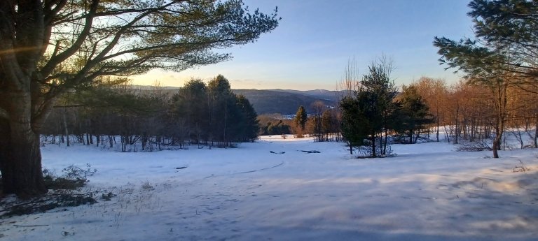 Freshman Field overlooking campus and the Green Mountains.