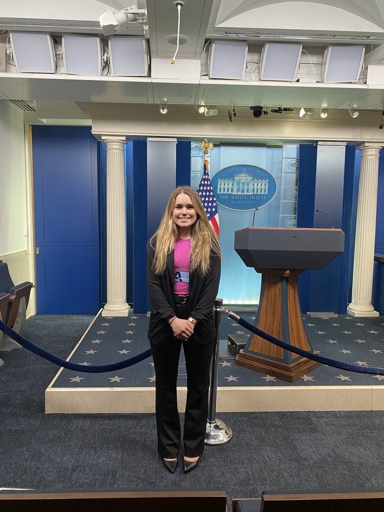 Sophia standing in front of podium.