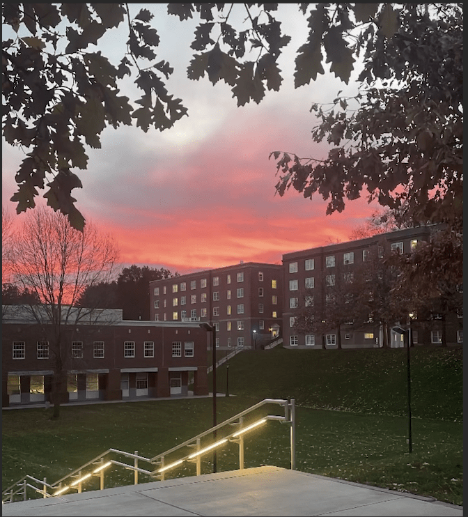 Photo of campus green and the barracks.