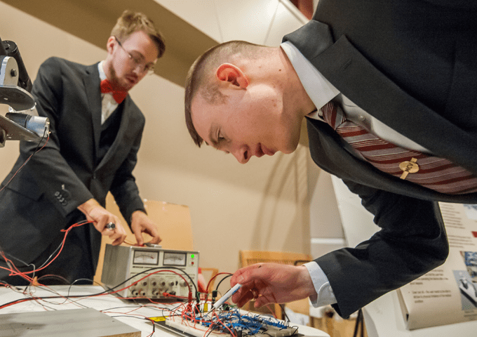 Norwich University Engineering Students working hands on with electronics 