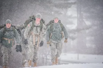 Three Mountain Cold Weather Cadets hiking in snow