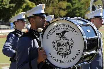 Norwich bass drum and percussionists at a stadium event.