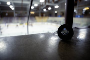 NCAA Division III Women’s Ice Hockey Championship puck displayed rink-side as Norwich prepares for the Frozen Four 