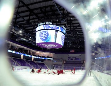 Norwich women’s hockey team gathers on ice during practice at Anderson Arena before NCAA Frozen Four 